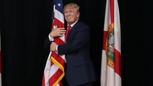 trump-hugging-a-flag-by-joe-raedle-getty-images-main